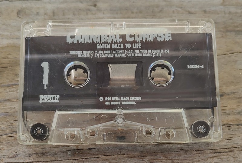 CANNIBAL CORPSE. EATEN BACK TO LIFE CASSETTE. TOMB OF THE MUTILATED J CARD.